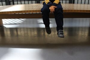 child sits on bench