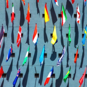 many international flags hung on a wall