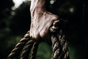 hand holds a rope