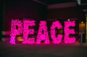 the word 'peace' spelt out in fairy lights