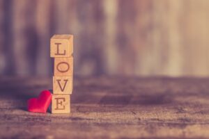 the word 'love' spelt out with alphabet blocks